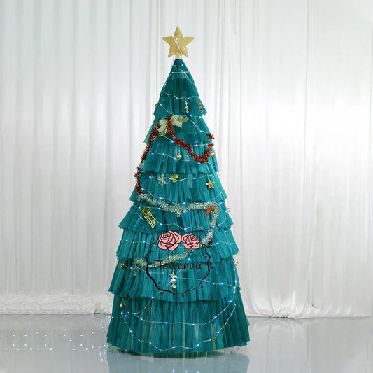 A Green Christmas Tree with a Yellow Start on the Top